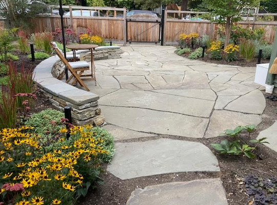 Spacious Patio Garden in Crown Hill - This front garden was overrun with grass and weeds, and didn’t have a viable space to spend time in. (See the “Before” photos) Our clients were eager for a fresh start!

We designed a working patio space for outdoor dining and the occasional game of ping-pong. It features:

-A drystack stone wall that doubles as a seating bench
-New front fence with gate
-Bluestone patio for entertaining and relaxing
-New plantings designed for full sun, maximum bloom, and joy!