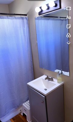 Bathroom remodel - This bathroom needed a small remodel. I came up with a new design idea for the client: remodel the old section inside the wall, patch it, and replace the mirror with a larger one. I also changed the light fixture, repaired the sink cabinet, replaced the window, and finally repainted the entire bathroom.