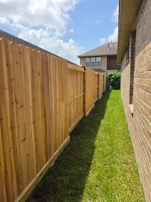 wood fence and concrete driveway. - the fence is on different locations.