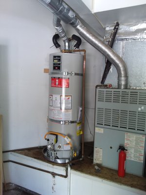 Water heater replacement - Same day installation. Taking out an old 50 gallon water heater that got water all over the place due to a crack in the cheap plastic drain pan, and Installing up to code 50 gallon water heater.