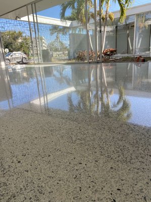 terrazzo restoration - Terrazzo restoration is a meticulous process that requires expertise and precision to revitalize and enhance the beauty of this timeless flooring option. At KJZ Floor Solutions, we specialize in terrazzo restoration, bringing decades of experience and a commitment to excellence to every project.

The restoration process typically begins with a thorough assessment of the existing terrazzo flooring. Our team carefully evaluates the condition of the surface, identifying any cracks, stains, or other imperfections that need to be addressed.

Next, we embark on the repair phase, where we meticulously fill in any cracks or holes using specialized techniques and materials. This step is crucial for ensuring a smooth and uniform surface once the restoration is complete.

Once the repairs are complete, we move on to the grinding and honing stage. Using advanced equipment and techniques, we gradually grind down the surface of the terrazzo to remove any surface imperfections and reveal the underlying beauty of the aggregate.

After grinding, we proceed to honing, which involves smoothing the surface to achieve a uniform texture and appearance. This step is essential for creating a seamless transition between the different components of the terrazzo flooring.

The final stages of the restoration process involve polishing and sealing the terrazzo surface to enhance its shine and durability. Our team utilizes high-quality polishing compounds and sealants to achieve a stunning finish that will stand the test of time.

Throughout the entire restoration process, we take great care to protect surrounding surfaces and minimize disruption to your space. Our goal is to provide you with a beautifully restored terrazzo floor that exceeds your expectations and brings new life to your space.