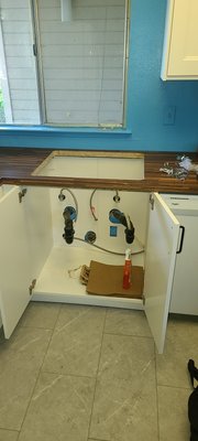 Installation of new sink, disposal and faucet. - Installation of Sink, disposal and faucet was completed after customer did their kitchen remodeled.