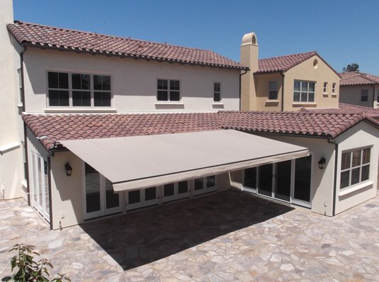 Elite Retractable Awning - Before & After - The Elite Retractable Awning is built using the highest quality materials. Engineered for superior versatility, durability and elegance, the Elite retractable patio awning series can do it all. With the ability to span widths from 6 feet up to 80 feet, and with six projections ranging from 5 feet to a maximum of 13 feet, it's easy to see why the Elite retractable awning is the most popular roll out awning we offer. Elite Retractable Awning - Before & After - The Elite Retractable Awning is built using the highest quality materials. Engineered for superior versatility, durability and elegance, the Elite retractable patio awning series can do it all. With the ability to span widths from 6 feet up to 80 feet, and with six projections ranging from 5 feet to a maximum of 13 feet, it's easy to see why the Elite retractable awning is the most popular roll out awning we offer.