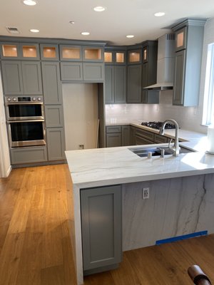 Handcrafted casework - Upgrade your kitchen with our custom-made Celadon cabinets paired with a stunning waterfall edge countertop! This perfect combination of modern elegance and timeless design will transform your space into a luxurious culinary haven. Crafted to your specifications, our bespoke cabinetry and sleek countertops offer both style and functionality. Make your kitchen a masterpiece with our tailored design solutions! Handcrafted casework - Upgrade your kitchen with our custom-made Celadon cabinets paired with a stunning waterfall edge countertop! This perfect combination of modern elegance and timeless design will transform your space into a luxurious culinary haven. Crafted to your specifications, our bespoke cabinetry and sleek countertops offer both style and functionality. Make your kitchen a masterpiece with our tailored design solutions!