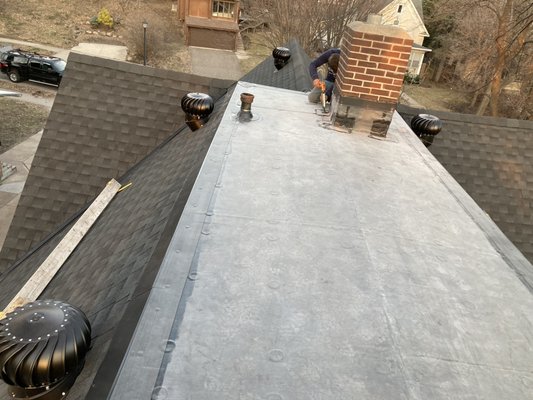 eRoof Flat Roof Project (EPDM) - eRoof was hired to replace a flat roof in SE Minneapolis. During the demolition of the existing roof, we discovered 10 layers of existing roofing dating back to the original structure, built in 1911. Our expert installers carefully removed each layer and prepared the roof deck for the modern roofing application.  Our flat roofing installers have over 30 years of experience, and with their esoteric and expert installation techniques applied the EDPM 60 mil rubber roof. The roof is now ready for many more decades of protection for this home.