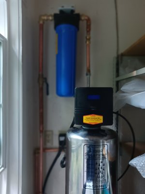 Reverse Osmosis and Water Softener with Big Blue sediment filter on customers well in Madera CA - This job was done at a farmhouse in Madera ca. This job required the pipe to be run along and through the wall to allow for the softener to be inside the garage and also to have a discrete drain line set up not visible to the customer's house guests. A 20-inch big blue sediment filter was used to protect the home from the damage sediment could cause to their equipment. Lastly, a reverse osmosis drinking water system was installed underneath the sink to allow for the cleaning of drinking water possible. Reverse Osmosis and Water Softener with Big Blue sediment filter on customers well in Madera CA - This job was done at a farmhouse in Madera ca. This job required the pipe to be run along and through the wall to allow for the softener to be inside the garage and also to have a discrete drain line set up not visible to the customer's house guests. A 20-inch big blue sediment filter was used to protect the home from the damage sediment could cause to their equipment. Lastly, a reverse osmosis drinking water system was installed underneath the sink to allow for the cleaning of drinking water possible.