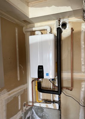 Tankless water heater installation - We removed an old inefficient tank type water heater that was not up to code and installed this energy star tankless water heater with a built in recirculating pump to also reduce wait time for hot water and save wasted water that goes down the drain waiting for hot water. Tankless water heater installation - We removed an old inefficient tank type water heater that was not up to code and installed this energy star tankless water heater with a built in recirculating pump to also reduce wait time for hot water and save wasted water that goes down the drain waiting for hot water.