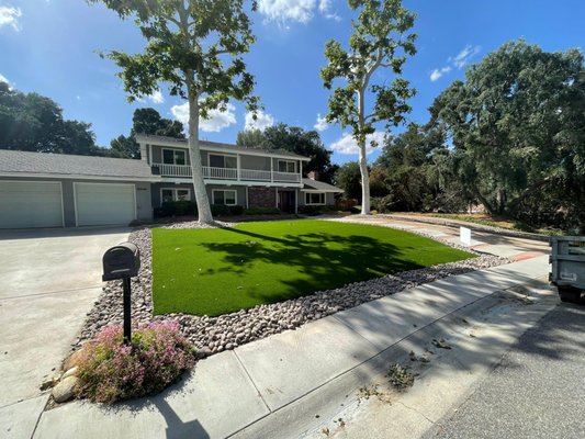 Backyard & Front Yard Transformation - This project focused on transforming both the front and backyard into a clean, modern, and low-maintenance outdoor space. The front yard was redesigned with premium artificial turf, decorative rock accents, and refreshed concrete for a polished, welcoming curb appeal.
In the backyard, we created a relaxing retreat featuring lush artificial grass, a custom pond with natural stone details, and defined pathways that enhance both flow and functionality. The space also includes a poolside upgrade and cozy seating areas, perfect for entertaining or unwinding.
The result is a beautiful, drought-friendly landscape that combines style, comfort, and long-term durability—perfectly suited for the California lifestyle. Backyard & Front Yard Transformation - This project focused on transforming both the front and backyard into a clean, modern, and low-maintenance outdoor space. The front yard was redesigned with premium artificial turf, decorative rock accents, and refreshed concrete for a polished, welcoming curb appeal.
In the backyard, we created a relaxing retreat featuring lush artificial grass, a custom pond with natural stone details, and defined pathways that enhance both flow and functionality. The space also includes a poolside upgrade and cozy seating areas, perfect for entertaining or unwinding.
The result is a beautiful, drought-friendly landscape that combines style, comfort, and long-term durability—perfectly suited for the California lifestyle.