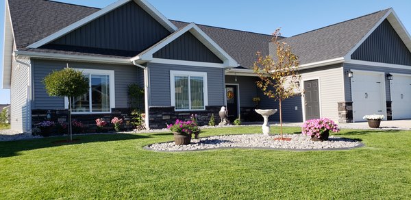 Miss C's Yard W. Fargo - This customer paid another contractor $7,000 and that paid for poor soil grade and weak seedlings that were planted but hardly grew and there was erosion. I was completing her neighbor's yard and she came and asked for help. Here is what we turned her lawn into. She was more than satisfied, and we remain friends to this day!