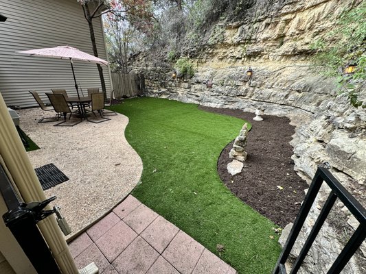 Backyard Artificial Turf Installation in Austin, TX - This backyard project in Austin, TX replaced bare soil with professionally installed synthetic turf to create a clean, low-maintenance outdoor space. The area was excavated, graded, and compacted to ensure proper drainage and a stable base.
Artificial turf was installed with defined edging to create a natural looking lawn that stays green year round without watering, mowing, or mud. The finished space provides a durable backyard area ideal for relaxing, entertaining, and everyday use. Backyard Artificial Turf Installation in Austin, TX - This backyard project in Austin, TX replaced bare soil with professionally installed synthetic turf to create a clean, low-maintenance outdoor space. The area was excavated, graded, and compacted to ensure proper drainage and a stable base.
Artificial turf was installed with defined edging to create a natural looking lawn that stays green year round without watering, mowing, or mud. The finished space provides a durable backyard area ideal for relaxing, entertaining, and everyday use.