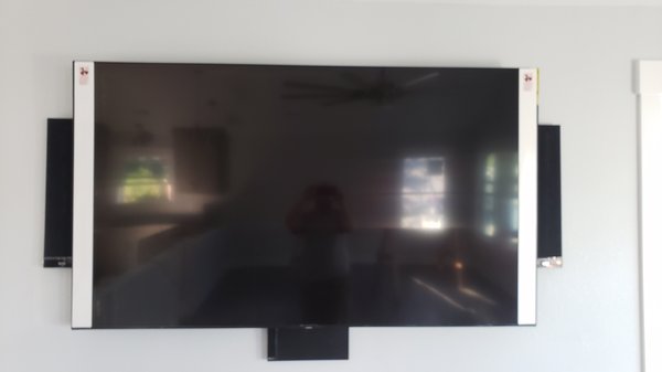 82 inch samsung tv and 5.1 surround sound - This great room system located in Kill Devil Hills, NC has an 82 inch Samsung QLED flat screen, KEF ultra thin on wall speakers for the fronts and center speakers and a pair of KEF in-ceiling speakers for the rears. It also has a Yamaha AV receiver hidden away in a utility room that powers the speakers in the great room and a pair of out door in-ceiling speakers located on the top deck. The top deck speakers can also be controlled with an app on your smart device. 82 inch samsung tv and 5.1 surround sound - This great room system located in Kill Devil Hills, NC has an 82 inch Samsung QLED flat screen, KEF ultra thin on wall speakers for the fronts and center speakers and a pair of KEF in-ceiling speakers for the rears. It also has a Yamaha AV receiver hidden away in a utility room that powers the speakers in the great room and a pair of out door in-ceiling speakers located on the top deck. The top deck speakers can also be controlled with an app on your smart device.