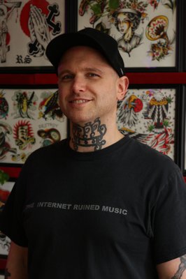 David Mosher - Hi! I’m David! I’ve been tattooing in and around Atlanta since 2017, and joined the Gate City crew in 2022. I do a little bit of everything but I especially like blackwork, illustrative, ornamental, and floral designs, with a personal style that mixes dark, moody imagery and delicate, graceful elements. Outside the shop, I spend a lot of time reading, writing, and making art in other forms. I’m into science fiction, magic and the occult, meditating, cartoons, and talking to animals like they can understand me. I’m pretty introverted by nature and awkward in crowds, and I know I can come off a little reserved at first, but I genuinely love connecting with people and hearing their stories. If you’ve got an idea you want to bring to life, whether it’s bold, weird, or sentimental, I’d be stoked to work with you!