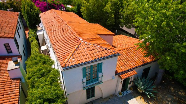 Fairfax Spanish villa Tile reset - Project: Complete Tile Roof Replacement – 9 Days
📍 Location: [Neighborhood or City if you want to include it]

We recently completed a full re-tiling of this beautiful Spanish-style roof in just 9 days — start to finish. The home had aging clay tiles that were weathered and leaking in spots. We carefully removed the old material, inspected and repaired the underlayment, and installed brand-new, high-grade clay tiles to match the original aesthetic and enhance curb appeal.

From the steep ridgelines to the custom flashing work, we took extra care to preserve the home’s historic charm while ensuring top-tier durability and waterproofing.