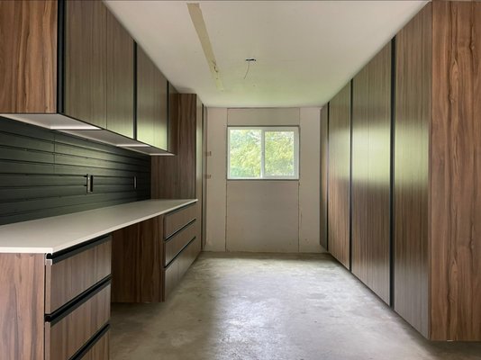 Garage Cabinets Rocklin - This garage features wood finish with black hardware, work bench area for home improvement and garage projects and a custom bicycle rack. We would love for all of our customers to enjoy this level of organization an style in their own garage! Garage Cabinets Rocklin - This garage features wood finish with black hardware, work bench area for home improvement and garage projects and a custom bicycle rack. We would love for all of our customers to enjoy this level of organization an style in their own garage!