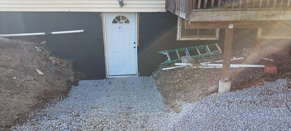 Foundation seal new door and  drain - This project was done on a house that was built-in 1970. The drain had failed over the years, and we were called to replace it.