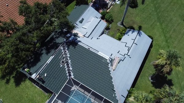 Roof Replacement 2023 - In the aftermath of Hurricane Ian's devastating impact on Florida, our latest roofing project stands as a beacon of resilience and durability. This project involved the installation of a stone-coated roof, a choice made by the homeowner to fortify their property against future hurricane threats in the Sunshine State.
Our journey with this project began when the homeowner reached out to us following the destruction caused by Hurricane Ian. They were determined to replace their hurricane-damaged roof with a solution that could withstand the powerful forces of nature. After a thorough inspection of the damage and discussions regarding the homeowner's requirements, we recommended the installation of a stone-coated metal roofing system.
Stone-coated roofing offers an exceptional level of durability and storm resistance, making it an ideal choice for hurricane-prone areas like Florida. It combines the aesthetic appeal of traditional roofing materials with the strength of metal, ensuring that the homeowner's property remains secure for years to come.
The installation of the stone-coated roof was executed meticulously by our experienced team. We used top-quality materials and the latest roofing technology to create a roofing system that is not only hurricane-proof but also energy-efficient, reducing long-term utility costs.
Throughout the installation process, we maintained open and transparent communication with the homeowner to ensure that their vision for a resilient roof was being met. The final result is a beautiful and robust stone-coated roof, providing both peace of mind during hurricane seasons and an attractive addition to the property's overall aesthetic.
At our roofing company, we understand the importance of safeguarding your home against the elements, especially in hurricane-prone regions like Florida. If you're considering upgrading to a stone-coated roof, don't hesitate to reach out to us. We are here to turn your vision of a hurricane-resistant and appealing roof into a reality. Roof Replacement 2023 - In the aftermath of Hurricane Ian's devastating impact on Florida, our latest roofing project stands as a beacon of resilience and durability. This project involved the installation of a stone-coated roof, a choice made by the homeowner to fortify their property against future hurricane threats in the Sunshine State.
Our journey with this project began when the homeowner reached out to us following the destruction caused by Hurricane Ian. They were determined to replace their hurricane-damaged roof with a solution that could withstand the powerful forces of nature. After a thorough inspection of the damage and discussions regarding the homeowner's requirements, we recommended the installation of a stone-coated metal roofing system.
Stone-coated roofing offers an exceptional level of durability and storm resistance, making it an ideal choice for hurricane-prone areas like Florida. It combines the aesthetic appeal of traditional roofing materials with the strength of metal, ensuring that the homeowner's property remains secure for years to come.
The installation of the stone-coated roof was executed meticulously by our experienced team. We used top-quality materials and the latest roofing technology to create a roofing system that is not only hurricane-proof but also energy-efficient, reducing long-term utility costs.
Throughout the installation process, we maintained open and transparent communication with the homeowner to ensure that their vision for a resilient roof was being met. The final result is a beautiful and robust stone-coated roof, providing both peace of mind during hurricane seasons and an attractive addition to the property's overall aesthetic.
At our roofing company, we understand the importance of safeguarding your home against the elements, especially in hurricane-prone regions like Florida. If you're considering upgrading to a stone-coated roof, don't hesitate to reach out to us. We are here to turn your vision of a hurricane-resistant and appealing roof into a reality.