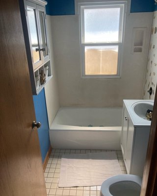 Kitchen/Bathroom remodel - This homeowner wanted to get rid of all the different changes in flooring throughout their home and update the bathroom. We came in and ran the beautiful tile they picked out from the kitchen through the hall and into the bathroom. We had enough left to install some new tile in the entry too! Kitchen/Bathroom remodel - This homeowner wanted to get rid of all the different changes in flooring throughout their home and update the bathroom. We came in and ran the beautiful tile they picked out from the kitchen through the hall and into the bathroom. We had enough left to install some new tile in the entry too!