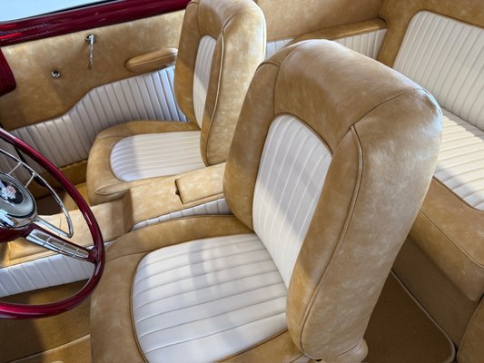 Buick Eight - This project features a full interior upholstery restoration on a classic Buick Eight, a pre-1950s luxury automobile known for its smooth straight-eight engine, elegant proportions, and high-end craftsmanship. Vehicles from this era were built very differently from modern cars, and restoring them properly requires experience with vintage construction methods, materials, and fitment.

For this Buick Eight, we completely reupholstered the interior with a focus on period-correct styling while delivering modern durability and comfort. The front and rear bench seats were rebuilt and upholstered using a two-tone combination that highlights the original design lines of the car. The pleated inserts provide structure and visual rhythm, while the surrounding panels add softness and depth, creating a balanced and timeless look that feels appropriate for a high-end classic.

The door panels were custom-made to match the seating layout, including correct pleat spacing, smooth transitions, and clean edge finishing. Every panel was shaped to follow the body contours of the car, which is especially important on older vehicles where nothing is perfectly flat or symmetrical. Proper fitment here is critical, and all panels were test-fitted and adjusted to ensure consistent gaps and alignment.

We also upholstered the rear interior panels, package shelf, and trunk area to maintain a cohesive look throughout the entire vehicle. The trunk was finished with tailored panels and carpeting that complement the interior materials, providing a clean, finished appearance rather than an afterthought. On classic cars like this, the trunk is often visible at shows and events, so attention to detail matters.

Throughout the project, we paid close attention to stitching quality, seam placement, foam shaping, and material tension. Vintage interiors require different techniques than modern automotive upholstery, especially when working around original metal frames, wood structures, and tight clearances. The goal is not just to make it look good, but to make it look correct.

This Buick Eight interior restoration reflects the craftsmanship and elegance these cars were known for when they were new. Whether the vehicle is destined for shows, weekend drives, or long-term preservation, the finished interior honors the car’s history while giving it a fresh, refined presentation.

If you own a classic or vintage vehicle and are looking for upholstery work that respects the original character of the car, projects like this demonstrate the level of detail and care we bring to every restoration.