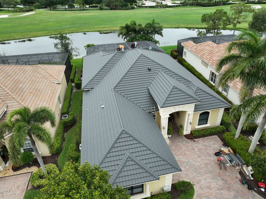 Metal Specialty Roof System Worthouse - After years of struggling with leaks and a failing concrete tile roof, this Port St. Lucie homeowner turned to us for a permanent solution — and peace of mind. The original roof, nearly 20 years old, had become a patchwork of repairs and growing concerns, especially in a high-stakes hurricane zone.
We replaced it with a WORTHOUSE® stone-coated steel roofing system, built to outperform both traditional tile and asphalt in strength, longevity, and style. With a 50+ year product warranty and exceptional wind resistance, this roof is designed to stand up to Florida’s toughest weather — year after year.
Beyond beauty and durability, this project reflects what we stand for: no subcontractors, no middlemen — just skilled metal roofers using U.S.-sourced materials and factory-direct systems. Every panel, flashing, and detail was installed with precision by our in-house team.
This home is now protected, weatherproof, and proudly covered by our 15-year workmanship warranty. More than a roof — it’s a legacy of quality, built for a family that deserves nothing less. Metal Specialty Roof System Worthouse - After years of struggling with leaks and a failing concrete tile roof, this Port St. Lucie homeowner turned to us for a permanent solution — and peace of mind. The original roof, nearly 20 years old, had become a patchwork of repairs and growing concerns, especially in a high-stakes hurricane zone.
We replaced it with a WORTHOUSE® stone-coated steel roofing system, built to outperform both traditional tile and asphalt in strength, longevity, and style. With a 50+ year product warranty and exceptional wind resistance, this roof is designed to stand up to Florida’s toughest weather — year after year.
Beyond beauty and durability, this project reflects what we stand for: no subcontractors, no middlemen — just skilled metal roofers using U.S.-sourced materials and factory-direct systems. Every panel, flashing, and detail was installed with precision by our in-house team.
This home is now protected, weatherproof, and proudly covered by our 15-year workmanship warranty. More than a roof — it’s a legacy of quality, built for a family that deserves nothing less.