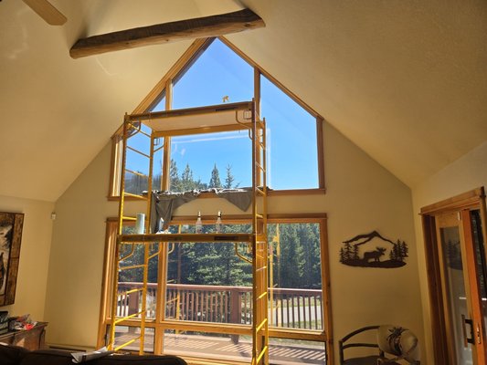 House in Big Sky - These windows offer a spectacular view in Big Sky, but also let in a lot of heat. I was able to help with this by removing the old faded film and adding a new reflective film to limit 99% UV and 90% heat coming in. The owner decided to do the remaining windows on that side of the house shortly after feeling the difference. House in Big Sky - These windows offer a spectacular view in Big Sky, but also let in a lot of heat. I was able to help with this by removing the old faded film and adding a new reflective film to limit 99% UV and 90% heat coming in. The owner decided to do the remaining windows on that side of the house shortly after feeling the difference.