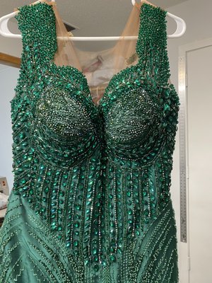 Dress - The beautiful dresses fits the customer but it was alter to fit the customers even better. Dress - The beautiful dresses fits the customer but it was alter to fit the customers even better.