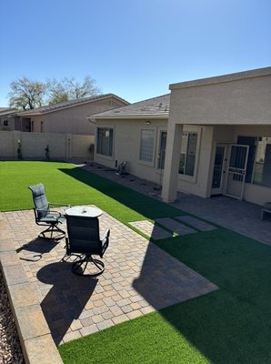 Project in Glendale - In this project we provided the client with a full backyard 3D design and the client approved all of our suggestions. We delivered this project with a paver patio overlay as well as an extra sitting area and barbecue area. We also installed a beautiful 65ft retaining wall with split face block matching the color of all the pavers and 1000 square feet of the wonderful vibrant triple green 90oz turf from turf sellers. And of course for a backyard to be complete you must add a variety of plants of your liking and an automatic drip system to do the work for you.