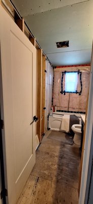 Bathroom Renovation - This renovation was done on an old bathroom. We tore down the walls and flooring and put up new drywall, tiled shower walls, painted everything, and added beautiful wood floors that matched the rest of the home. Bathroom Renovation - This renovation was done on an old bathroom. We tore down the walls and flooring and put up new drywall, tiled shower walls, painted everything, and added beautiful wood floors that matched the rest of the home.