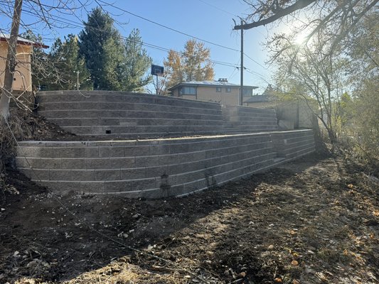 Lakewood project with two tiers retaining wall. - The homeowner had problems with an old retaining wall that was improperly built. He hired us to get it done right, with proper drainage and installation.