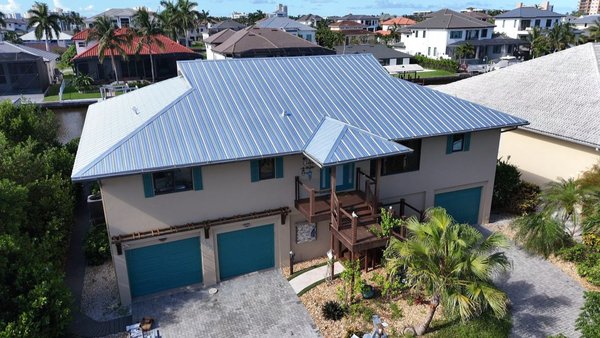 5V METAL - Our 5V metal roofs combine classic style with unmatched durability. This traditional panel profile features a clean, symmetrical "V" groove design that's ideal for both residential and light commercial buildings. It's especially popular for coastal and rural homes thanks to its sleek appearance and exceptional resistance to harsh weather. Whether you're looking for a modern farmhouse vibe or a tried-and-true solution for your property, our 5V metal roofing delivers performance you can trust.
Contact us today for a free estimate! (239)347-9207
