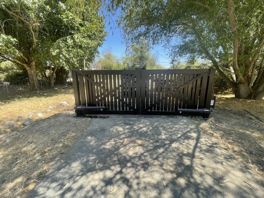 2 Double Swing Automatic Gates powered by Solar, 
LiftMaster - The customer had called our company and explained to us that they had a very hard time to get in and out of their very old gate. We listened to the customer’s request and made sure to create the most perfect gate for their property. In this project, we created two iron gates in our shop. We installed a LiftMaster Smart Gate Operator which is powered by solar.