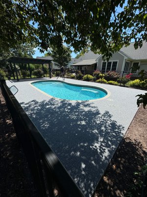Vuba Stone Pool - This concrete pool deck had cracked and settled, it was in bad need of repair. The owners in Bayhill Pointe of Midlothian, VA also wanted it to look wonderful again. They chose to have Ogburn Construction lift and stabilize their concrete, then apply Vuba Stone resin stone surfacing on top to give it a new look.
