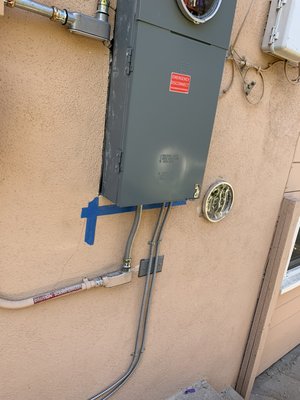 Electrical panel installation - New 200 amp service installed and existing PV conduit relocated and installed at new service panel