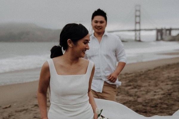 Wedding Photoshoot/Golden Gate Bridge, SF - Amid the iconic charm of San Francisco, Mie and Steven's day wedding read like a chapter from a storybook. Against the backdrop of the majestic Golden Gate Bridge, amidst the bustling downtown with cable cars chiming by, their love story unfolded with grace. From stolen glances by the bay to shared laughter under the city lights, each moment was a brushstroke of romance against this vibrant canvas. The camera caught every instance of their affection, a testament to their deep connection and the city's aura. A day where love, cityscapes, and dreams converged, etching a memory as timeless as San Francisco's signature sights. Wedding Photoshoot/Golden Gate Bridge, SF - Amid the iconic charm of San Francisco, Mie and Steven's day wedding read like a chapter from a storybook. Against the backdrop of the majestic Golden Gate Bridge, amidst the bustling downtown with cable cars chiming by, their love story unfolded with grace. From stolen glances by the bay to shared laughter under the city lights, each moment was a brushstroke of romance against this vibrant canvas. The camera caught every instance of their affection, a testament to their deep connection and the city's aura. A day where love, cityscapes, and dreams converged, etching a memory as timeless as San Francisco's signature sights.
