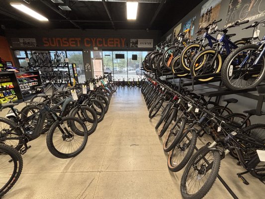 Showroom Floor - Our Showroom floor offers a wide variety of Bikes and E-Bikes! We carry a good selection of helmets, gloves, apparel, and safety gear! No matter what bike you have we have the parts and accessories to get you riding! Showroom Floor - Our Showroom floor offers a wide variety of Bikes and E-Bikes! We carry a good selection of helmets, gloves, apparel, and safety gear! No matter what bike you have we have the parts and accessories to get you riding!