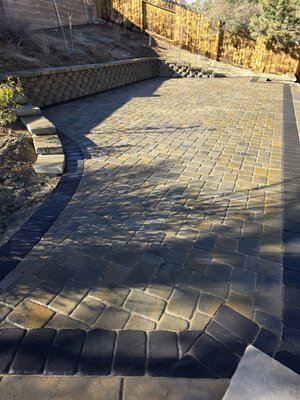 New Patio makeover using Belgard Cambridge Cobble in Victorian blend. - Patio remodel and Retaining wall using Belgard Cambridge cobble pavers in Victorian blend. This area was all dirt, and the customer was not able to fully utilize, this beautiful patio will allow our costumer to build the greenhouse she always wanted!