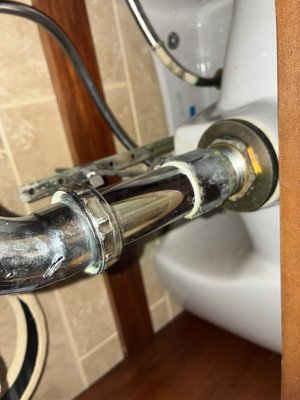 Vanity Sink Repair - This was a leaking vanity sink. We replaced the pop up assembly and piping. The trap assembly was also replaced. After replacement a leak test was performed and passed.