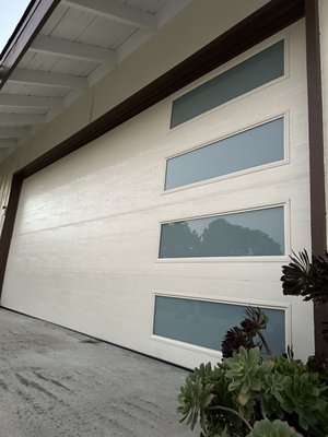 Garage door installation Steel Back Flush Wood Texture, almond color - This made in the USA beautiful garage door,  steel back, flush wood texture, almond color,  was just installed today in a stunning quiet neighborhood. 
Face ID recognition also installed with MYQ along with liftmaster opener installation.