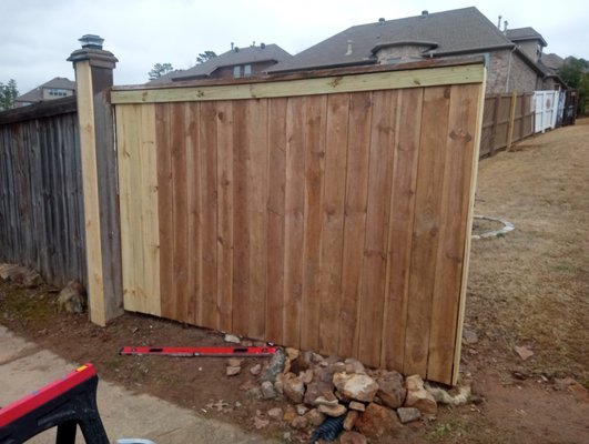Fence repaired in Maumelle, Arkansas 2/2024. - This repair was done on a wooden fence in Maumelle, Arkansas. Fence was leaning out and had come loose from the 4x4 fence posts. I reset the posts and leveled them. I then reattached the fence framing and had to replace several of the 2x4 framing boards. I then replaced all the rotten fence planks with new ones making sure each one was level before securing to the fence framing. Fence repaired in Maumelle, Arkansas 2/2024. - This repair was done on a wooden fence in Maumelle, Arkansas. Fence was leaning out and had come loose from the 4x4 fence posts. I reset the posts and leveled them. I then reattached the fence framing and had to replace several of the 2x4 framing boards. I then replaced all the rotten fence planks with new ones making sure each one was level before securing to the fence framing.