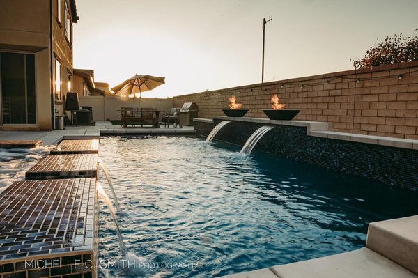 Pool Builders - Modern pool and spa with rectangle firepit and fire bowls. This pool features two sheer decents, two firebowls, 8 back jets and 4 foot jets in the spa. Large over sized reef. Swim lane and 7ft depth. Quartzscapes plaster and 1x2 tiles on the entire spa. Project range $70-$80K
Are you interested in something elegant and one of a kind? Give us a call today for a quote! Pool Builders - Modern pool and spa with rectangle firepit and fire bowls. This pool features two sheer decents, two firebowls, 8 back jets and 4 foot jets in the spa. Large over sized reef. Swim lane and 7ft depth. Quartzscapes plaster and 1x2 tiles on the entire spa. Project range $70-$80K
Are you interested in something elegant and one of a kind? Give us a call today for a quote!