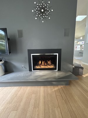 Fireplace direct vent install - Customer wanted to update her living room fireplace, so we provided several options to fit her style and needs. She chose a direct vent gas insert fireplace, and the final result completely transformed the space.

This model features a convenient remote control that operates the thermostat, lighting, and flame height for maximum comfort and ease of use. It also includes beautiful up-lighting through the glass, creating a warm and elegant atmosphere.

She was extremely happy with the outcome and loved the modern look and functionality of her new fireplace.