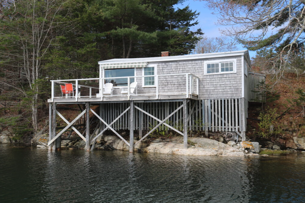 Wharf Cottage - Built over the water! with views up and down the shoreline, Wharf Cottage sleeps up to 4 in a combination bed room / sitting room (one queen bed and a twin bed, with a bunk over it). Has a woodstove for cool foggy days, and a roll-out awning over the sunny deck. Built in 1953, the Wharf Cottage is our smallest at about 400 square feet. Wharf Cottage - Built over the water! with views up and down the shoreline, Wharf Cottage sleeps up to 4 in a combination bed room / sitting room (one queen bed and a twin bed, with a bunk over it). Has a woodstove for cool foggy days, and a roll-out awning over the sunny deck. Built in 1953, the Wharf Cottage is our smallest at about 400 square feet.