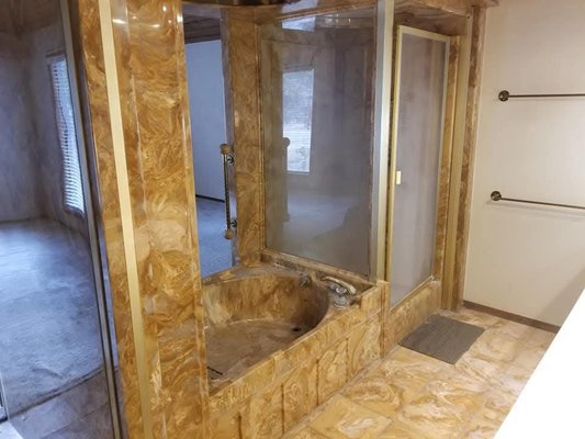 Demolition of the luxury bathroom. - This demolition was done in a house off of the golf course in Broken Arrow. It took me a day to do by myself. I'd love to help you with your next project.