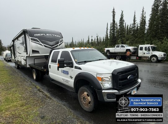 ALCAN BORDER -USA/CANADA - Alcan Border - USA/ CANADA At the Alcan Border, we are on the move, handling a heavy fifth-wheel RV with the kind of care and confidence that keeps Alaska rolling. Tagging along was our Slide-back tow truck to bring their rig along for the ride.