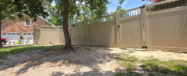 Before & After - Tired of your old wood fence rotting, leaning, and needing a fresh coat every few years? Supreme Site Services will tear it out and replace it with a clean adobe vinyl fence with picket tops that looks great and stays that way. Vinyl won't rot, never needs paint or stain, and holds up to South Carolina heat and humidity. It's truly maintenance free, and it's backed by a 20 year manufacturer warranty. Plus, it's more affordable than most folks expect. Locally owned and operated, our team handles the removal, haul off, and install so you don't lift a finger. Before & After - Tired of your old wood fence rotting, leaning, and needing a fresh coat every few years? Supreme Site Services will tear it out and replace it with a clean adobe vinyl fence with picket tops that looks great and stays that way. Vinyl won't rot, never needs paint or stain, and holds up to South Carolina heat and humidity. It's truly maintenance free, and it's backed by a 20 year manufacturer warranty. Plus, it's more affordable than most folks expect. Locally owned and operated, our team handles the removal, haul off, and install so you don't lift a finger.