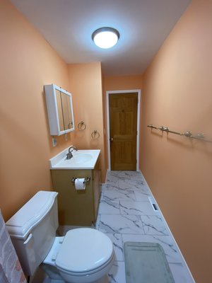Bathroom remodel. - This was a remodel completed on a bathroom where the wallpaper had been installed directly to the drywall causing havoc during removal. The drywall need to be skim coated for a smooth finish after paper removal and repairs. The lighting was relocated to the ceiling and a new exhaust fan was installed along with new flooring. Tub, toilet, vanity and fixtures were reused for cost savings. Bathroom remodel. - This was a remodel completed on a bathroom where the wallpaper had been installed directly to the drywall causing havoc during removal. The drywall need to be skim coated for a smooth finish after paper removal and repairs. The lighting was relocated to the ceiling and a new exhaust fan was installed along with new flooring. Tub, toilet, vanity and fixtures were reused for cost savings.