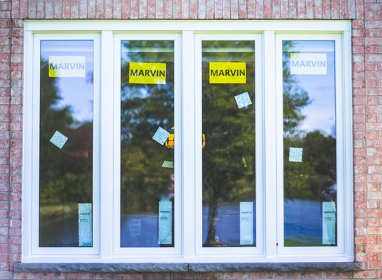 Barrington - Marvin Signature Series -97 Windows - This  Barrington homeowner requested wood windows to match the existing craftsmanship around the house. After going over the different options, they chose the Marvin Signature series. Overall this was a very big project for a residential home at 97 windows and 2 doors!