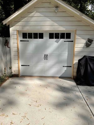 Face Lift - Giving a face lift to an older detached garage. We were hired to do a little woodwork, install a new side mount opener, and install a new carriage style door. Finished product looked great. Face Lift - Giving a face lift to an older detached garage. We were hired to do a little woodwork, install a new side mount opener, and install a new carriage style door. Finished product looked great.