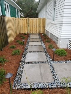 Paver walkway and bed installation - This is one of many paver walkways we have completed for a customer. They can be customized to your preference. Fresh pine straw adds so much beauty to your property.