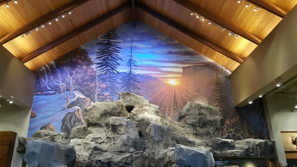 Commercial Sporting Goods Store Mural Project on Canvas and on Location - This project was for Cabela's/BassPro Sporting Goods. There was a total of 12 canvas mural panels and one mural onsite for a total of over 3200 square feet. The 12 panels were all painted on canvas, shipped to the client and installed by outside contractors, with the exception of the last pic with the sunset. That was painted onsite. This took 4-5 weeks to complete. Great project. Commercial Sporting Goods Store Mural Project on Canvas and on Location - This project was for Cabela's/BassPro Sporting Goods. There was a total of 12 canvas mural panels and one mural onsite for a total of over 3200 square feet. The 12 panels were all painted on canvas, shipped to the client and installed by outside contractors, with the exception of the last pic with the sunset. That was painted onsite. This took 4-5 weeks to complete. Great project.