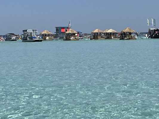 Crab Island Tours - Enjoy your summer vacation in Destin, Florida on our private boat to Crab Island.  We also offer sunset cruises.   

Experience your vacation in sunny Destin, Florida on the beautiful emerald coast waters of Crab Island. As you travel through Destin Harbor into the Choctawhatchee Bay to the submerged island, you can enjoy the abundant wildlife and sightseeing nearby. 

Our Coast Guard licensed and experienced charter boat captain picks you up at the dock and takes you to the submerged island where you can enjoy your day walking in the clear emerald water, swimming, lounging around or exploring. You will be taken back to the dock after the conclusion of the excursion. 

There are numerous vendors on small boats selling ice cream, pineapples, coconuts, watermelon and pizza. A floating general store and hamburger restaurant are located on the island as well.

We provide a cooler with ice and cups for your food or drinks since no alcoholic beverages are sold on the island. We also provide a Bluetooth stereo so you can connect and listen to your favorite music as you enjoy the day.  We also have floating BOTE chairs and a 10' lilypad for your enjoyment.
